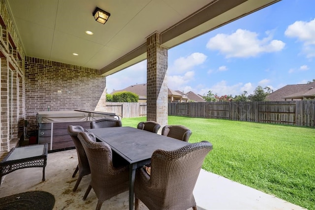 view of patio with a hot tub