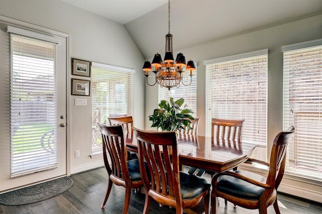 dining space with dark hardwood / wood-style flooring, lofted ceiling, and a notable chandelier