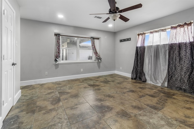 spare room featuring ceiling fan