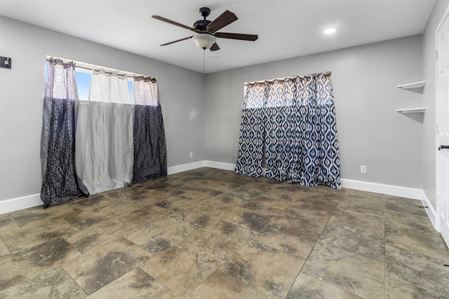 unfurnished room featuring ceiling fan