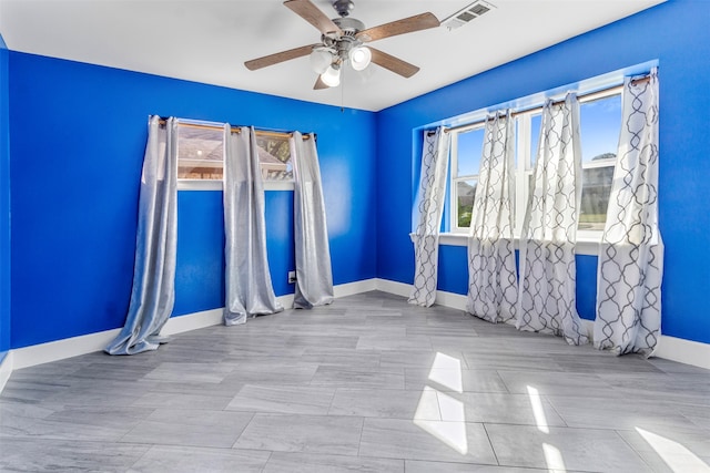 unfurnished room with ceiling fan