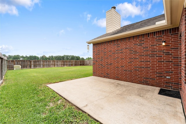 view of yard featuring a patio area and a fenced backyard