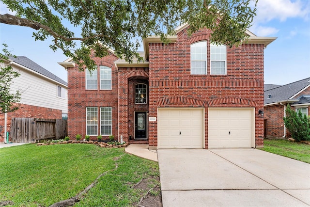 traditional-style home featuring concrete driveway, brick siding, a front lawn, and fence