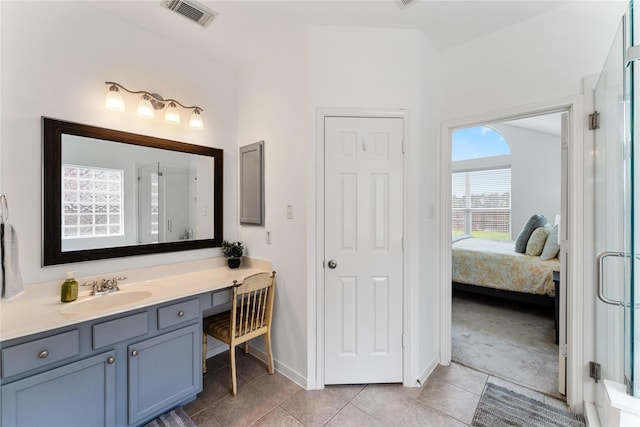 bathroom with a stall shower, visible vents, ensuite bath, tile patterned flooring, and vanity