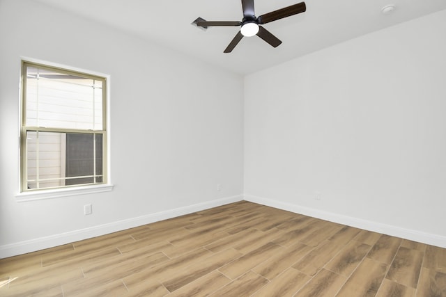 empty room featuring light hardwood / wood-style flooring and ceiling fan