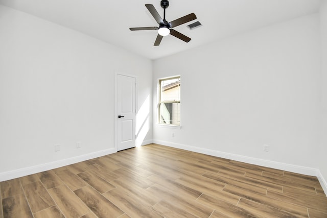 unfurnished room featuring ceiling fan and wood-type flooring