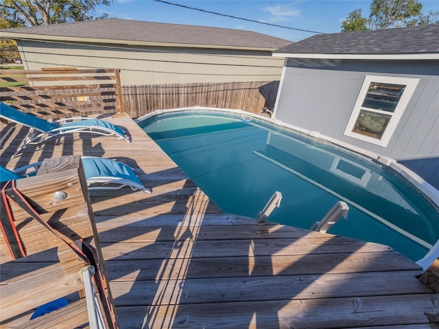 view of pool with a wooden deck