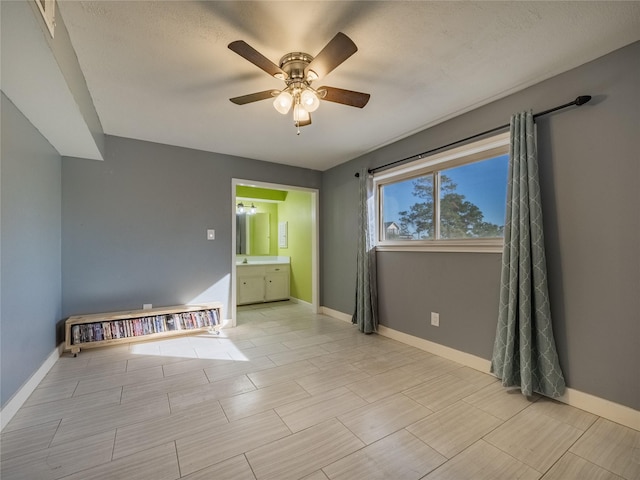 spare room featuring ceiling fan