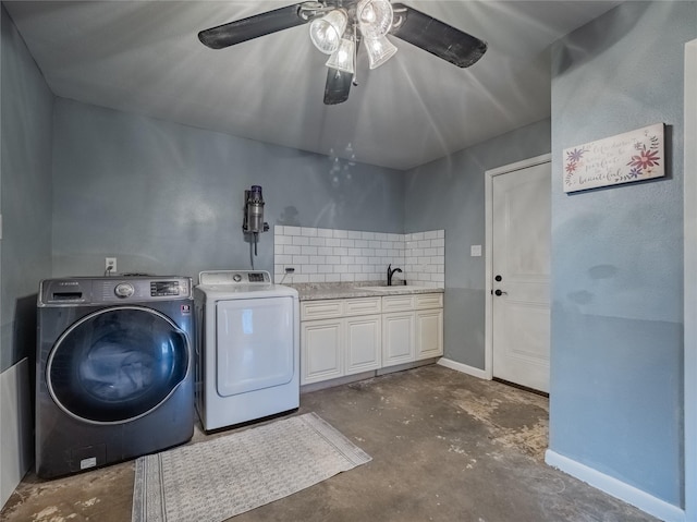 washroom with ceiling fan, cabinets, independent washer and dryer, and sink