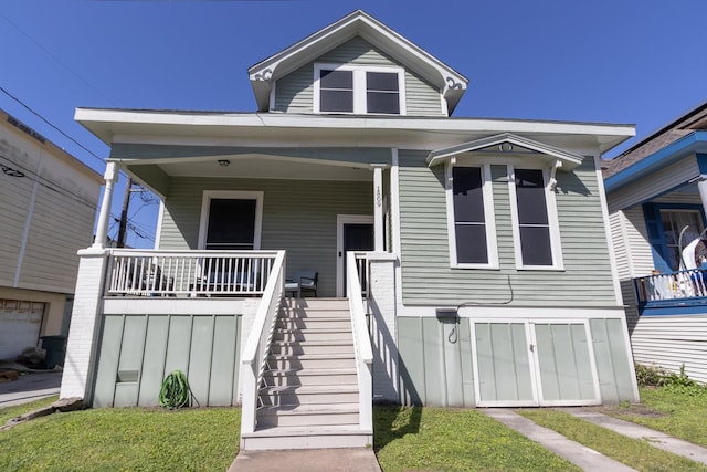 view of front of home with covered porch and stairway