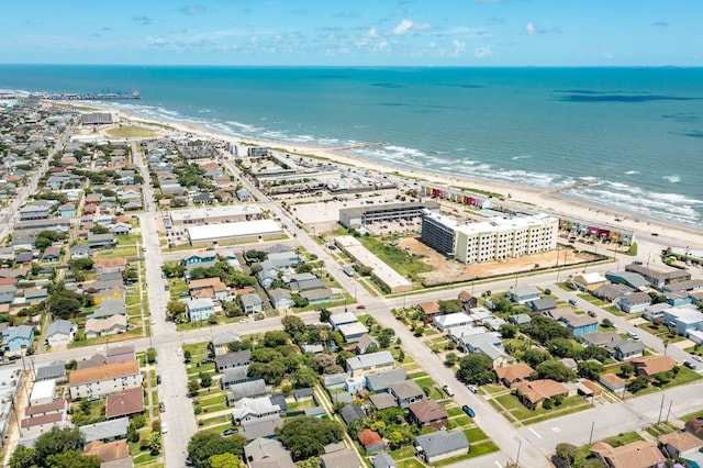 drone / aerial view with a water view and a view of the beach