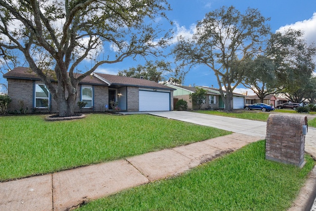 ranch-style house featuring a front yard and a garage