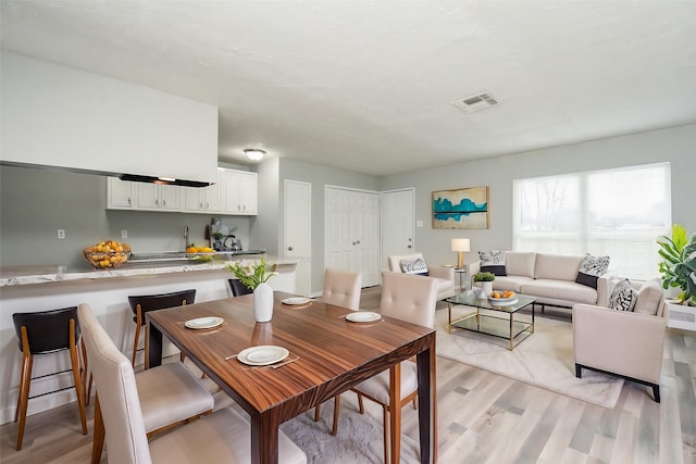 dining space featuring light hardwood / wood-style flooring