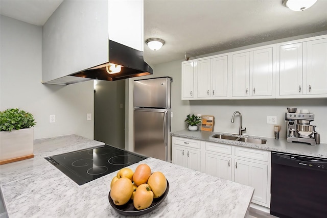 kitchen with sink, light stone counters, black appliances, white cabinets, and island exhaust hood