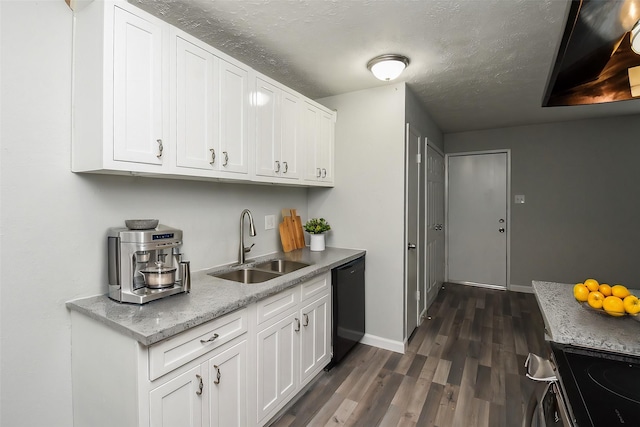 kitchen featuring sink, dishwasher, dark hardwood / wood-style floors, white cabinets, and a textured ceiling