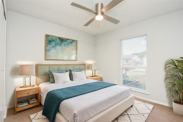 carpeted bedroom featuring ceiling fan