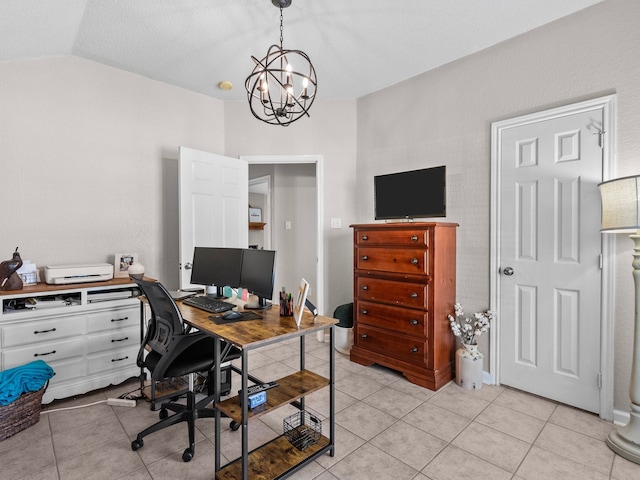 tiled office with lofted ceiling and an inviting chandelier