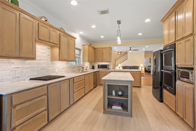 kitchen with appliances with stainless steel finishes, backsplash, ornamental molding, a center island, and hanging light fixtures