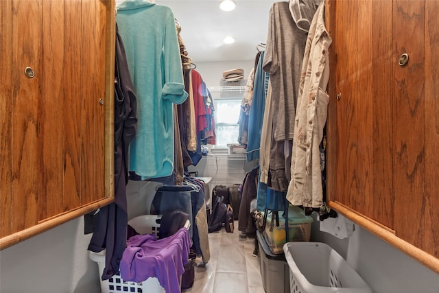 spacious closet featuring light tile patterned floors