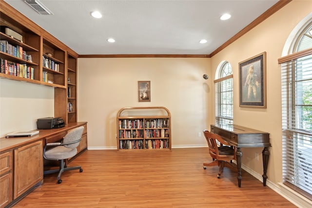 office area featuring light wood-type flooring and ornamental molding