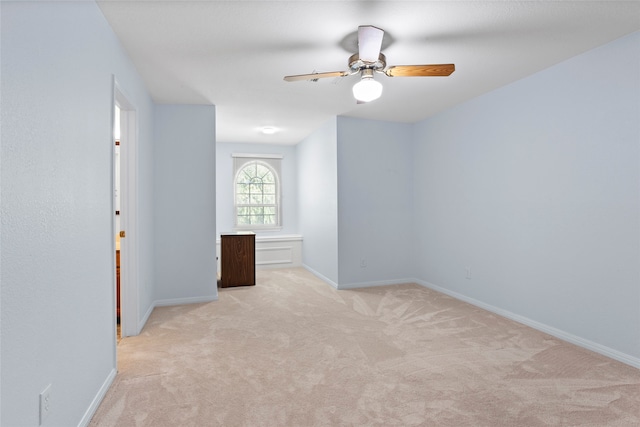 carpeted empty room with ceiling fan