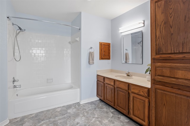 bathroom with vanity and tiled shower / bath