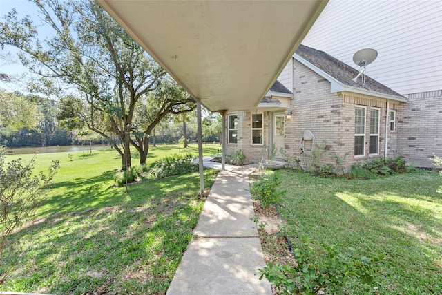 entrance to property featuring a yard