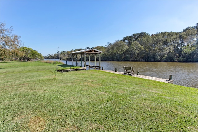 dock area featuring a yard and a water view