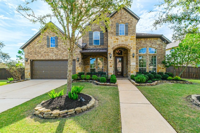 view of front of property with a front yard and a garage