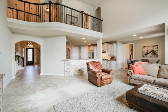 living room with a high ceiling