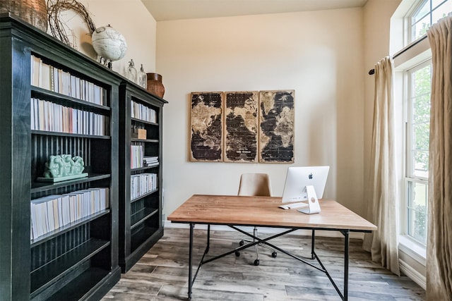 home office with hardwood / wood-style flooring