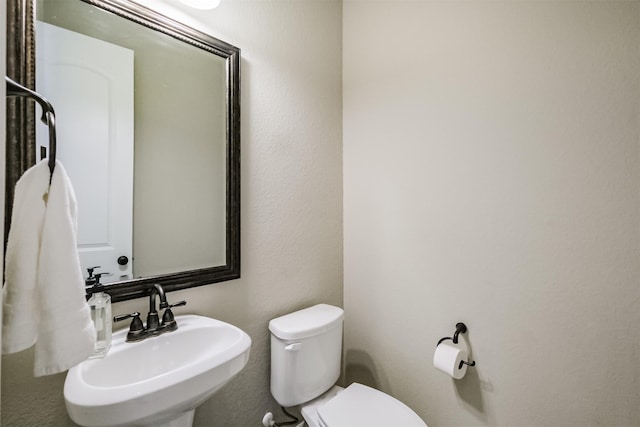 bathroom with sink and toilet