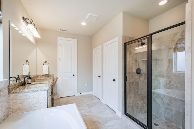 bathroom with separate shower and tub and vanity