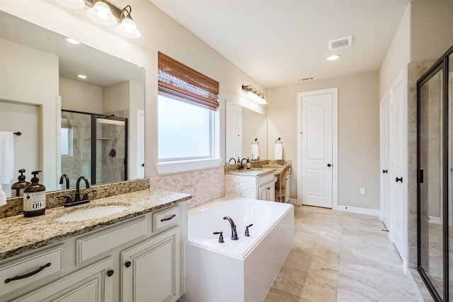 bathroom with shower with separate bathtub and vanity