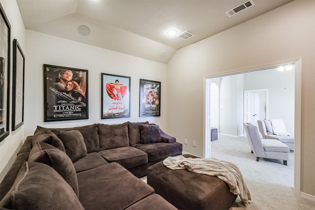 living room with lofted ceiling and light carpet