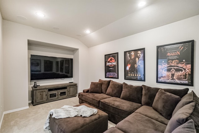 carpeted living room with lofted ceiling