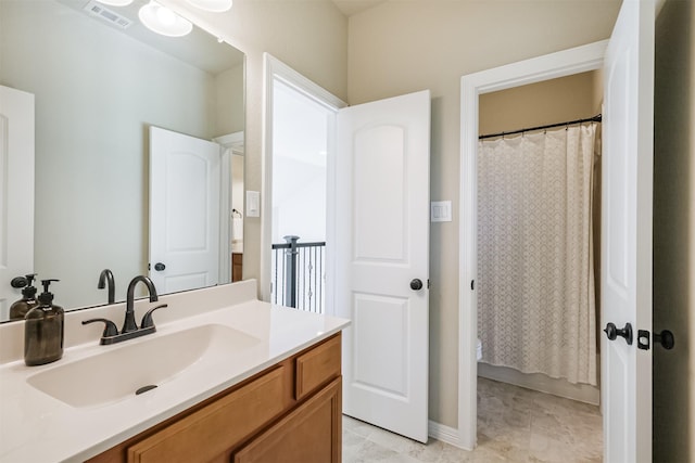 bathroom with tile patterned flooring and vanity