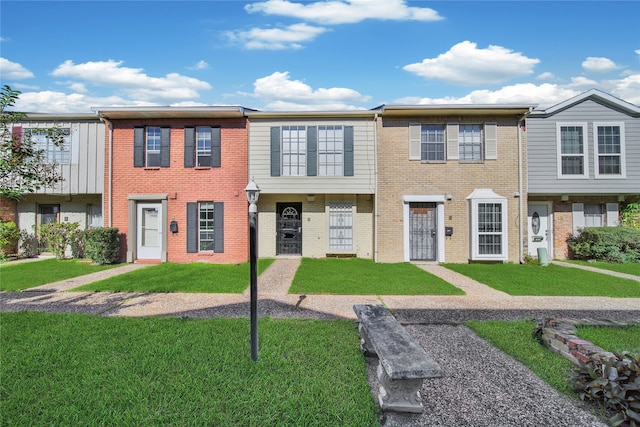 view of property featuring a front yard