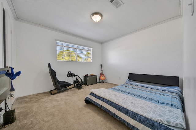 bedroom with carpet floors and crown molding