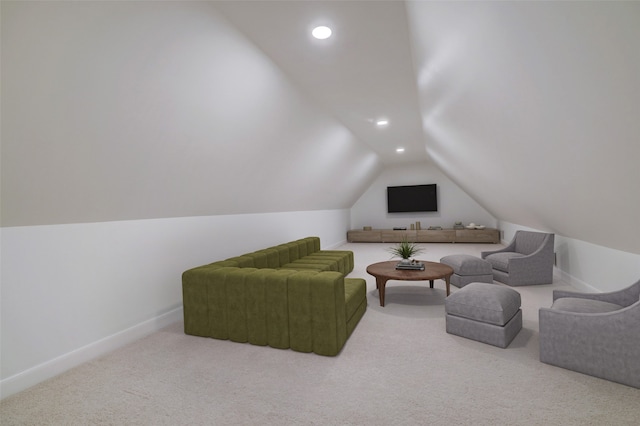 sitting room with carpet and lofted ceiling