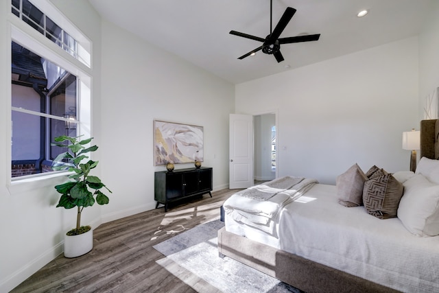 bedroom with ceiling fan and hardwood / wood-style floors