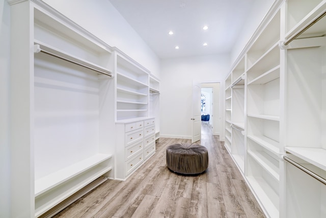 walk in closet featuring light hardwood / wood-style flooring