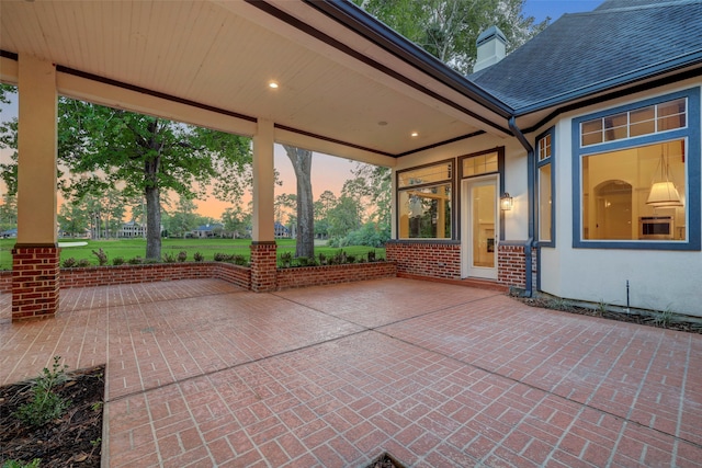 view of patio terrace at dusk