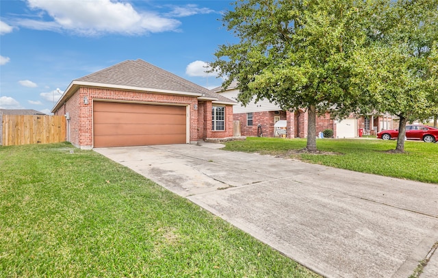 view of front of property featuring a front yard and a garage