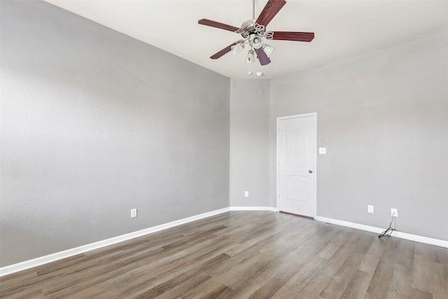 empty room featuring hardwood / wood-style floors and ceiling fan