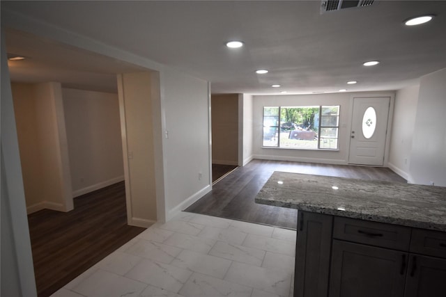 entryway with hardwood / wood-style flooring