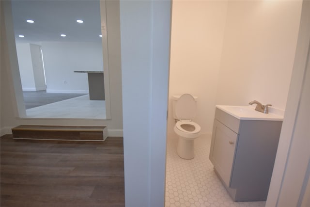 314 Reese Rd, Crosby, TX 77532 - bathroom with vanity, toilet, recessed lighting, and baseboards