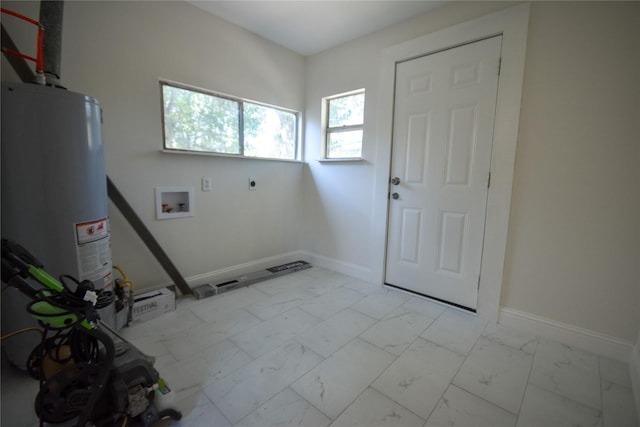 314 Reese Rd, Crosby, TX 77532 - laundry room featuring electric dryer hookup, hookup for a washing machine, marble finish floors, and baseboards