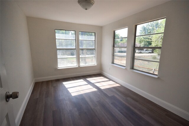 314 Reese Rd, Crosby, TX 77532 - spare room featuring baseboards and dark wood-style flooring