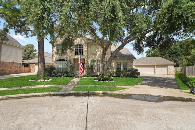 view of front facade featuring a garage and a front lawn